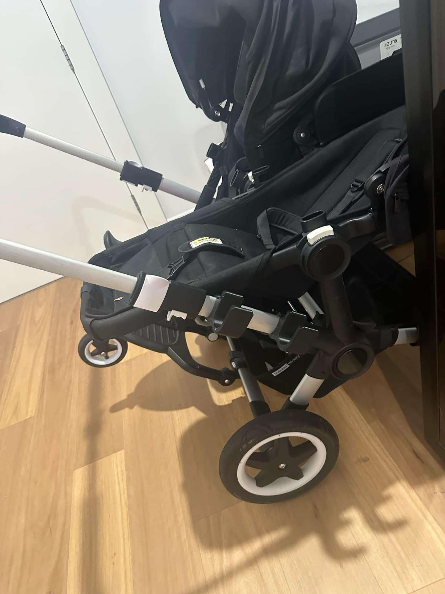 Balance bike / scooter holder for pram