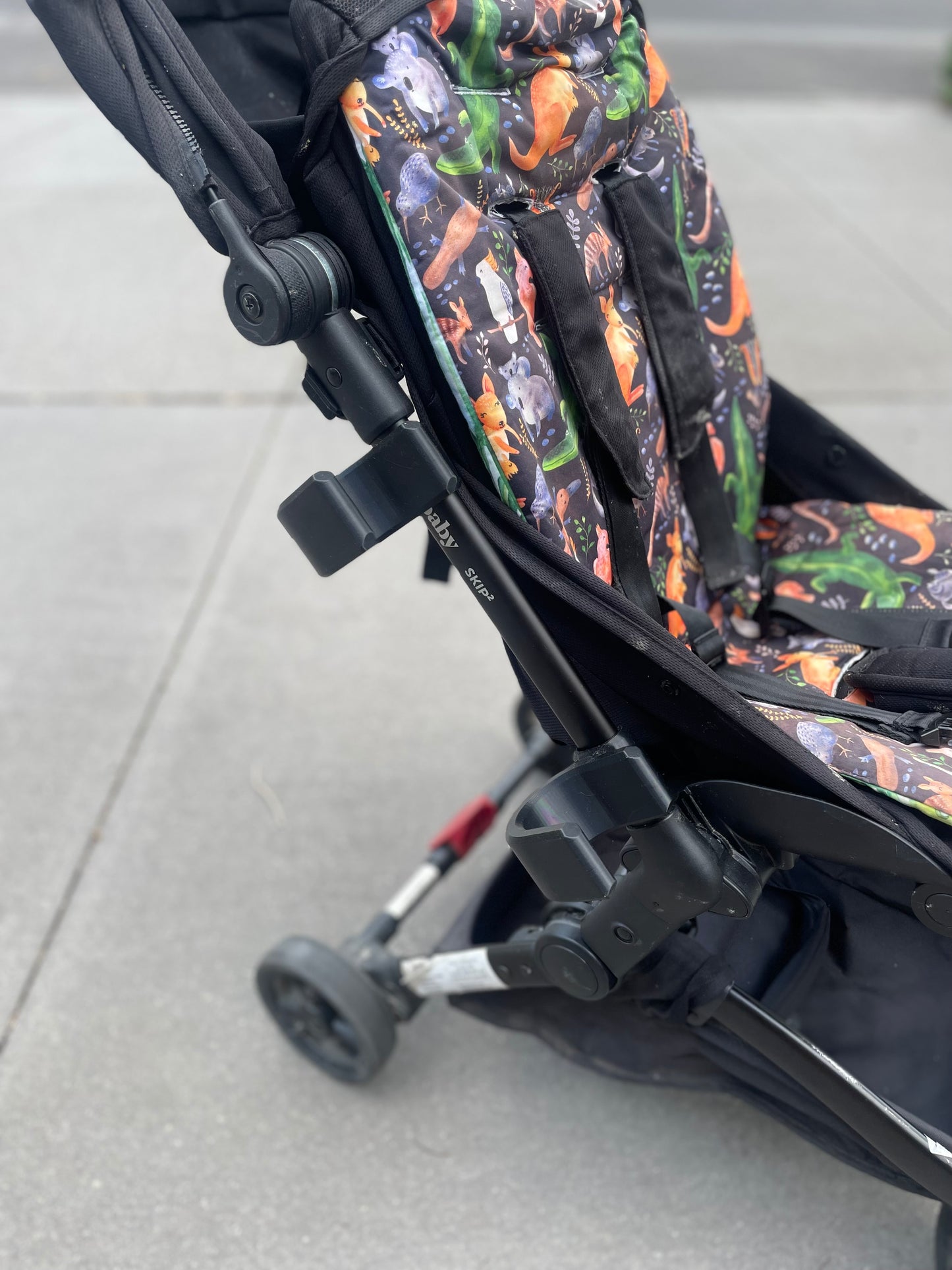 Balance bike / scooter holder for pram