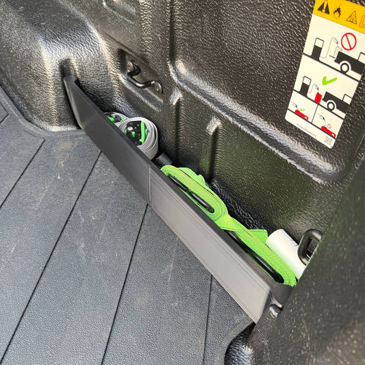 Ranger ute tray divider fitted along the back of the tub with ratchet straps stowed behind it
