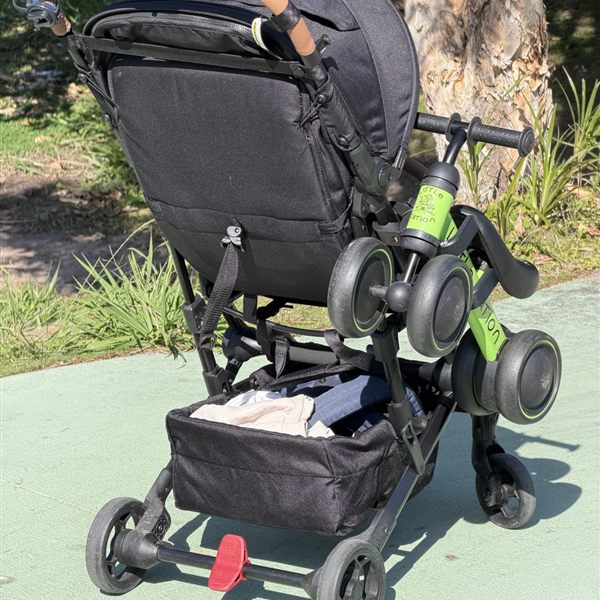 Hook n Go carrying a balance bike on a travel stroller